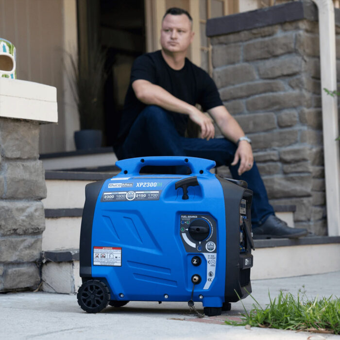 User lifting lightweight DuroMax XP2300iH generator using built-in carry handle