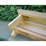 Side shot of Cedar 1805 Traditional Heavy Duty Bench, showcasing 60"W seating area and weather-resistant Western Red Cedar material as a reliable wooden bench
