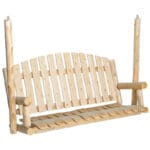 Cedar log porch swing in garden setting