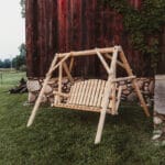 Rustic wood swing in garden setting