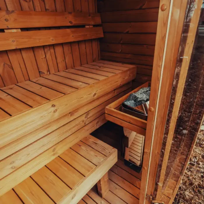 sleek outdoor sauna cube with black trim