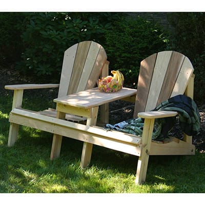 Side profile of durable Cedar Adirondack Settee, featuring weather-resistant design, wide slats, and built-in table in this adirondack chair settee for decks.