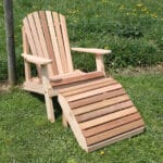 Front view of Cedar American Forest Adirondack Chair & Footrest Set, an adirondack chair wood pairing from Western Red Cedar with sloped chair and matching ottoman for extended lounging.