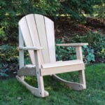 Detail view of rocker base and fittings on Cedar Adirondack Rocking Chair, showcasing zinc-plated hardware and refined edges in durable adirondack rocking chair.
