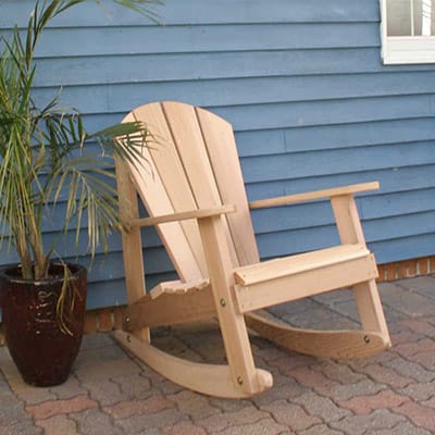 Cedar Adirondack Rocking Chair in porch environment, highlighting rich golden patina and ergonomic design as a timeless adirondack rocking chair for retreats.