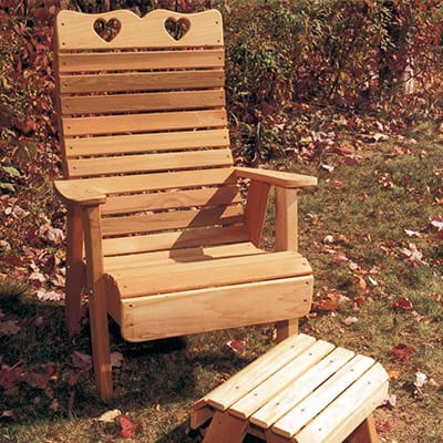 Cedar Royal Country Hearts Patio Chair in yard setting, highlighting amber-hued finish and country-inspired hearts as a charming patio chair for terraces
