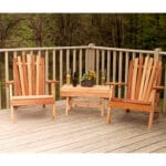Cedar American Forest Adirondack Chair Collection in garden placement, showcasing amber glow and sloped backs as a relaxing outdoor adirondack chair grouping for vantage points.