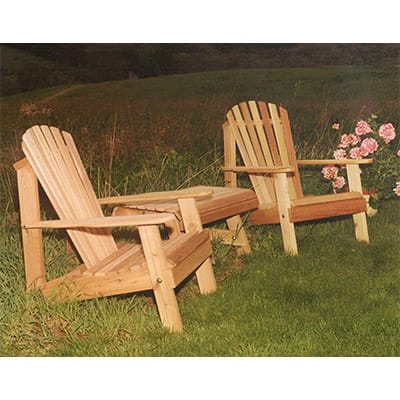 Side profile of the Cedar American Forest Adirondack Chair Collection, highlighting contoured seats, wide slats, and matching table in this outdoor adirondack chair ensemble