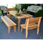 Side angle of durable Cedar Gathering Dining Set, showcasing weather-resistant build, contoured benches, and unified design in this wood dining table arrangement.