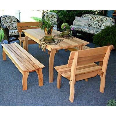 Side angle of durable Cedar Gathering Dining Set, showcasing weather-resistant build, contoured benches, and unified design in this wood dining table arrangement.