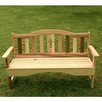 Cedar Holy Cross Garden Bench in outdoor setting, showcasing natural honey-brown hue, holy cross accents, and rustic charm as versatile solid wood furniture for patios or lawns