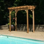 Cedar New Dawn Pergola in yard setting, showcasing honey-brown hue and open-air design as a stylish wood pergola for vine support.