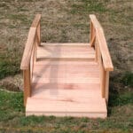 Side profile of durable Cedar Pearl River Garden Bridge, highlighting curved design, weather-resistant Western Red Cedar construction, and sturdy decking in this wood bridge for ponds