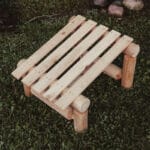 Cedar log slanted ottoman on patio
