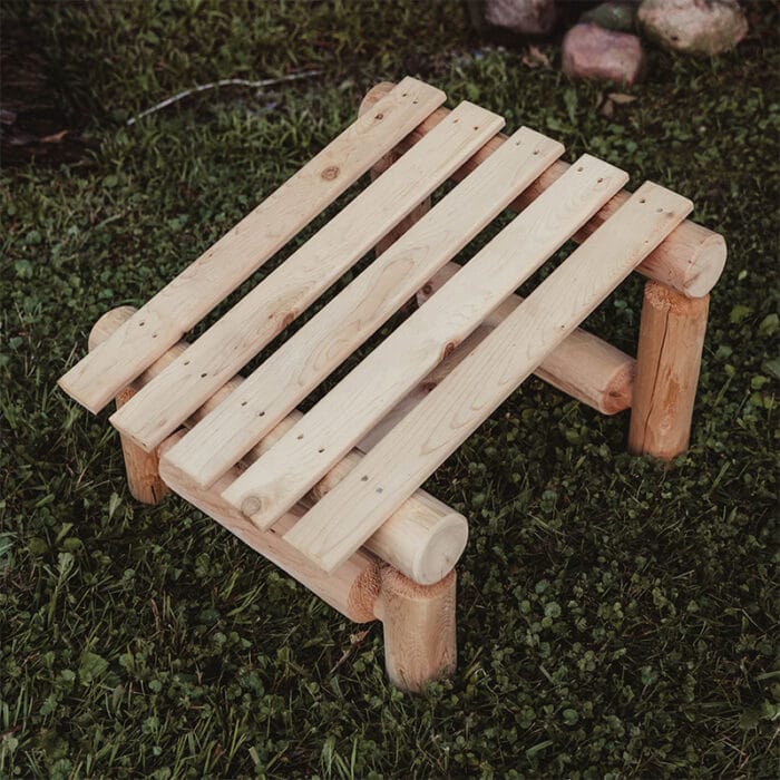 Cedar log slanted ottoman on patio