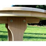 Overview of Cedar Round Trestle Dining Set with benches extended, illustrating supportive structure and stable base for versatile round wood dining table use.