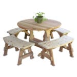 Front view of Cedar Round Trestle Dining Set, a round wood dining table from Western Red Cedar with trestle base and three curved benches for space-saving meals.