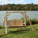 Cedar swing set placed in garden area