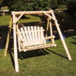 Wooden log swing under open sky