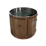 Built-in cedar step next to stainless steel plunge tub