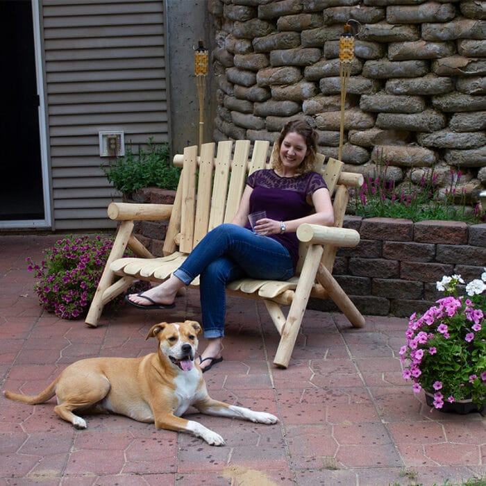 Handcrafted wood loveseat on porch