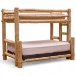 Rustic cedar log bunk bed in cabin-style guest room