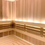 Finished cedar tongue and groove lumber for sauna wall installation