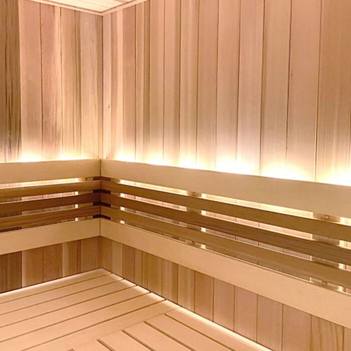 Finished cedar tongue and groove lumber for sauna wall installation