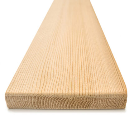 Natural cedar wood boards stacked for sauna build