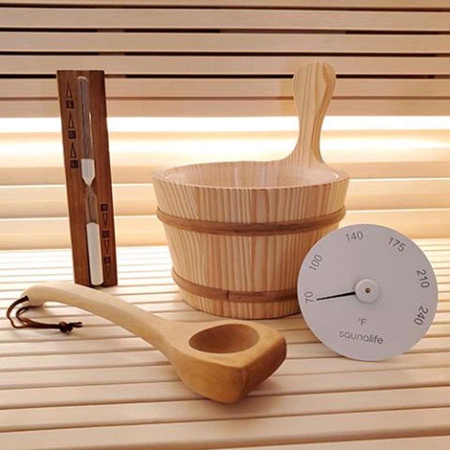 Included premium accessory kit for barrel saunas – bucket, ladle, sand timer, thermometer, and hygrometer