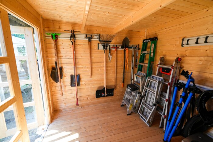 Modern backyard wood shed with dark stain finish