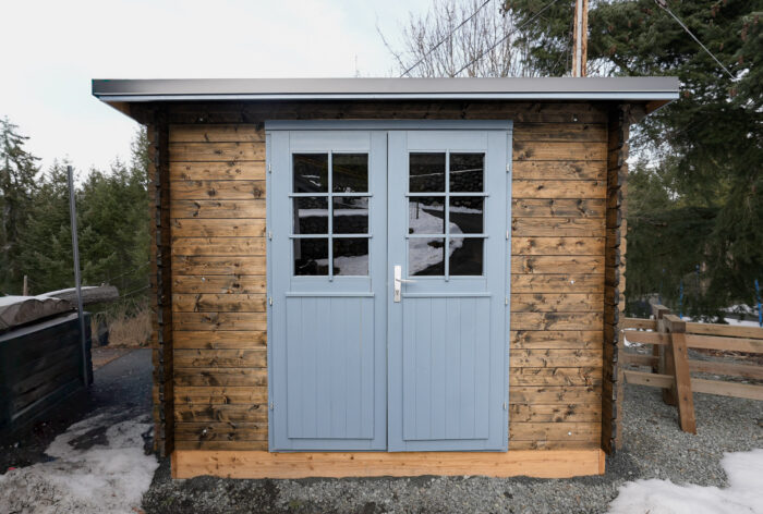 Shed interior organized for lawn tools and garden gear